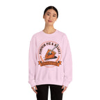 Person wearing a Light Pink sweatshirt with a pumpkin pie graphic and text on a white background