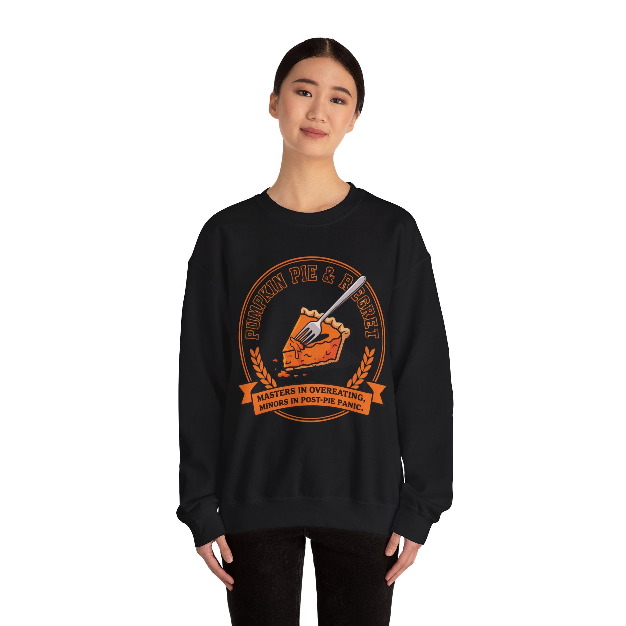 Black sweatshirt with pumpkin pie graphic and text worn by a model on a white background