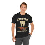 Man wearing a black t-shirt with 'Bruxism Grinding Your Teeth and My Patience' text and graphic.