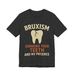 Gray t-shirt with graphic of a tooth and text 'Bruxism Grinding Your Teeth And My Patience'