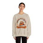Person wearing a Beige sweatshirt with a pumpkin pie graphic and text on a white background